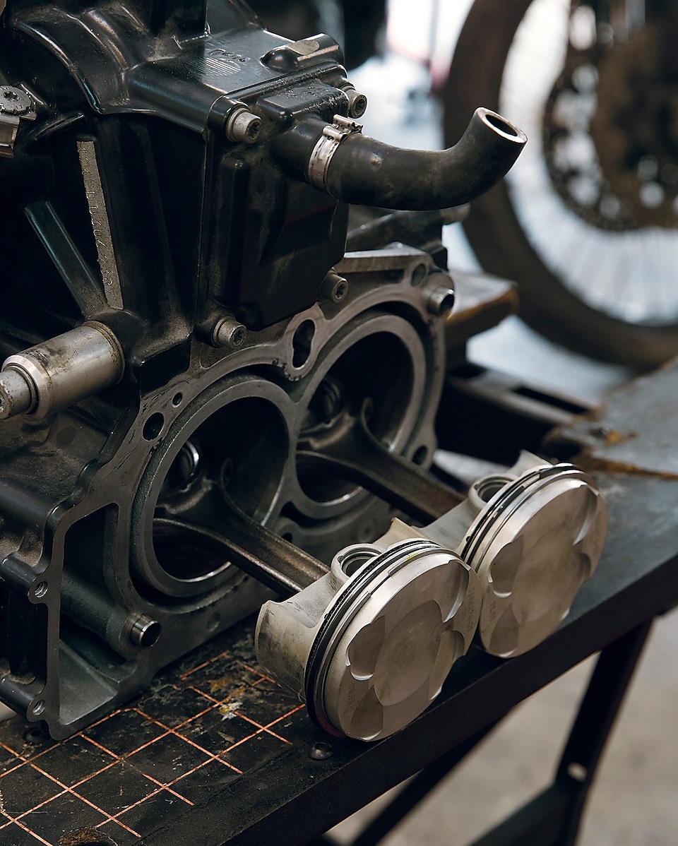 image of a parked motorcycle focusing on the pistons