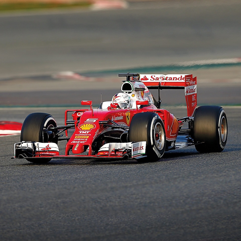 A red Scuderia Ferrari sits on a racing track, an example of Shell Helix Ultra’s Innovation Partnership