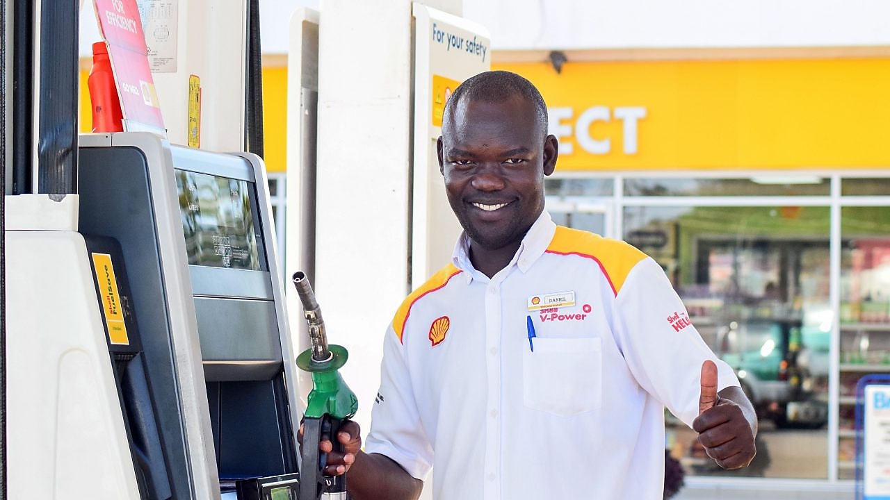 Ugandan Customer Champion on the forecourt